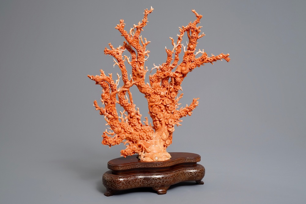 A Chinese carved red coral 'blossom tree' group on inlaid wooden stand, 19/20th C.